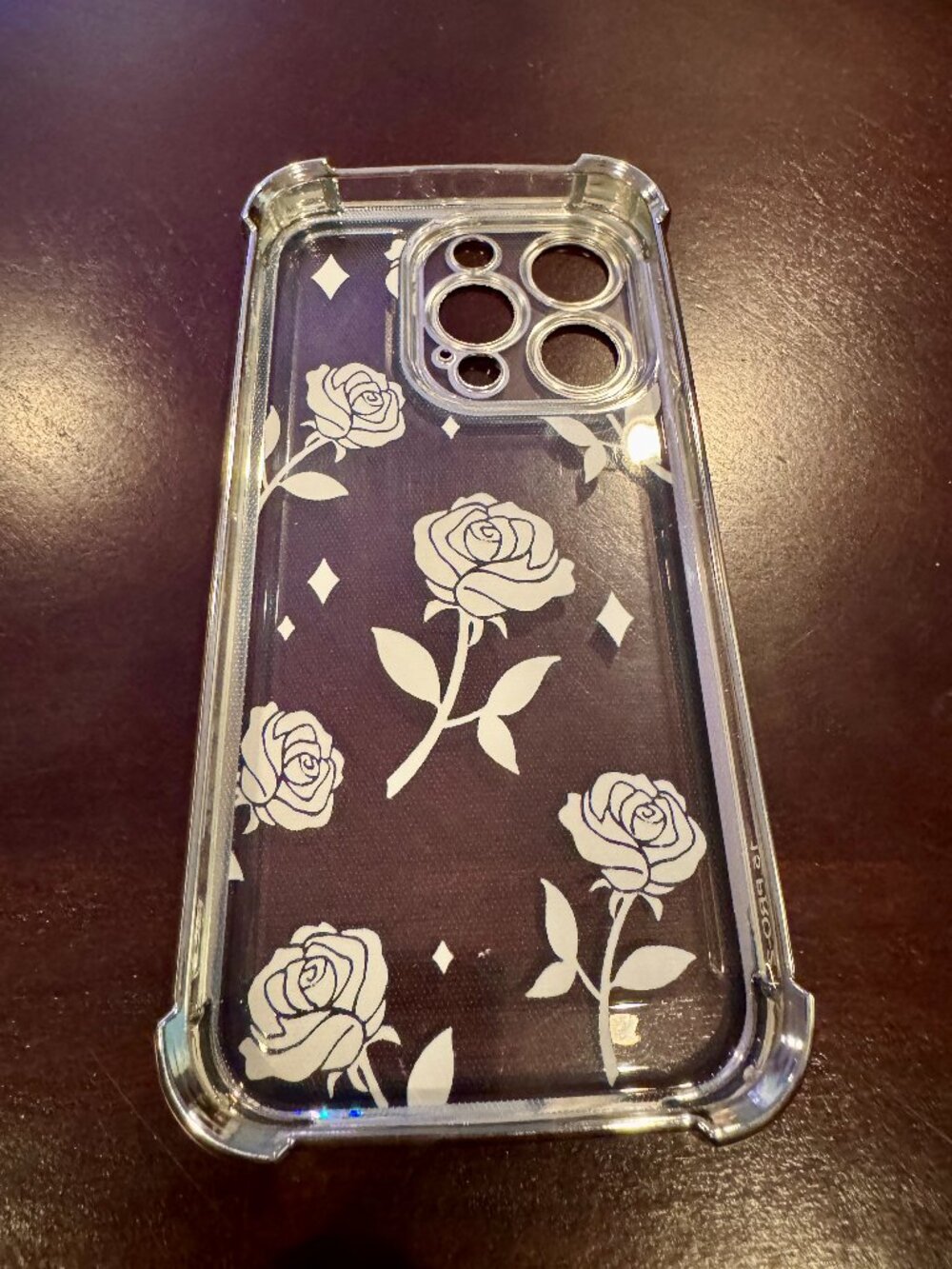 iPhone 15 Pro phone case rose pattern on clear background